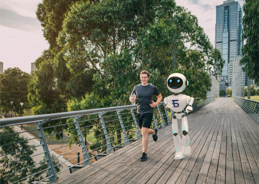 A person jogging alongside a humanoid robot on a wooden bridge, with trees and a tall building in the background.