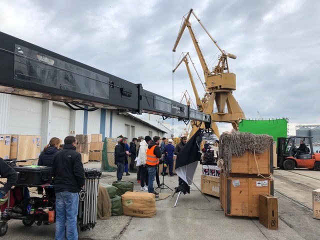 Camera crane and set dressing on the dock