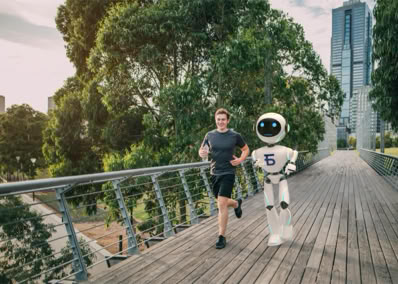 A person jogging alongside a humanoid robot on a wooden bridge, with trees and a tall building in the background.