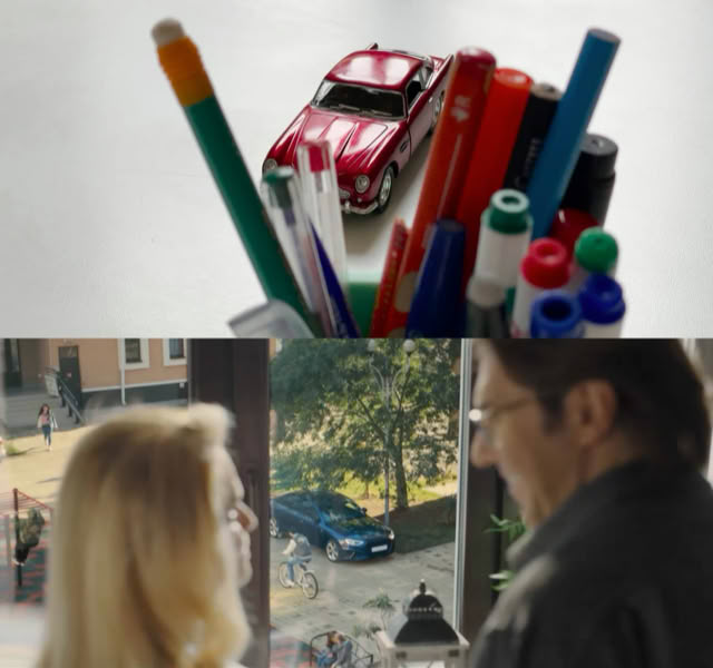 Toy-car test vs commercial still: couple watching the delivered car